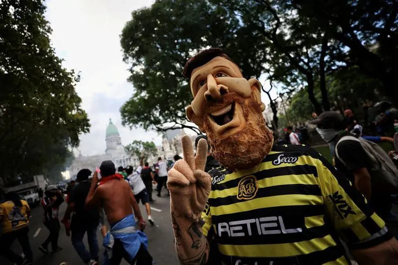 Argentine Pensioners and Rival Soccer Fans Unite in Protest Outside Congress