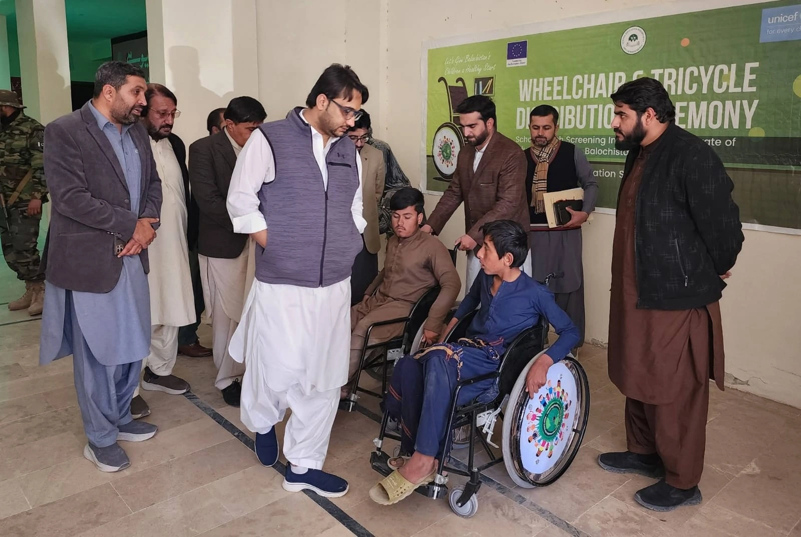 Distributes Wheelchairs to Children