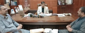 FDA officials reviewing digital balloting plan for residential plots in FDA City Faisalabad.
