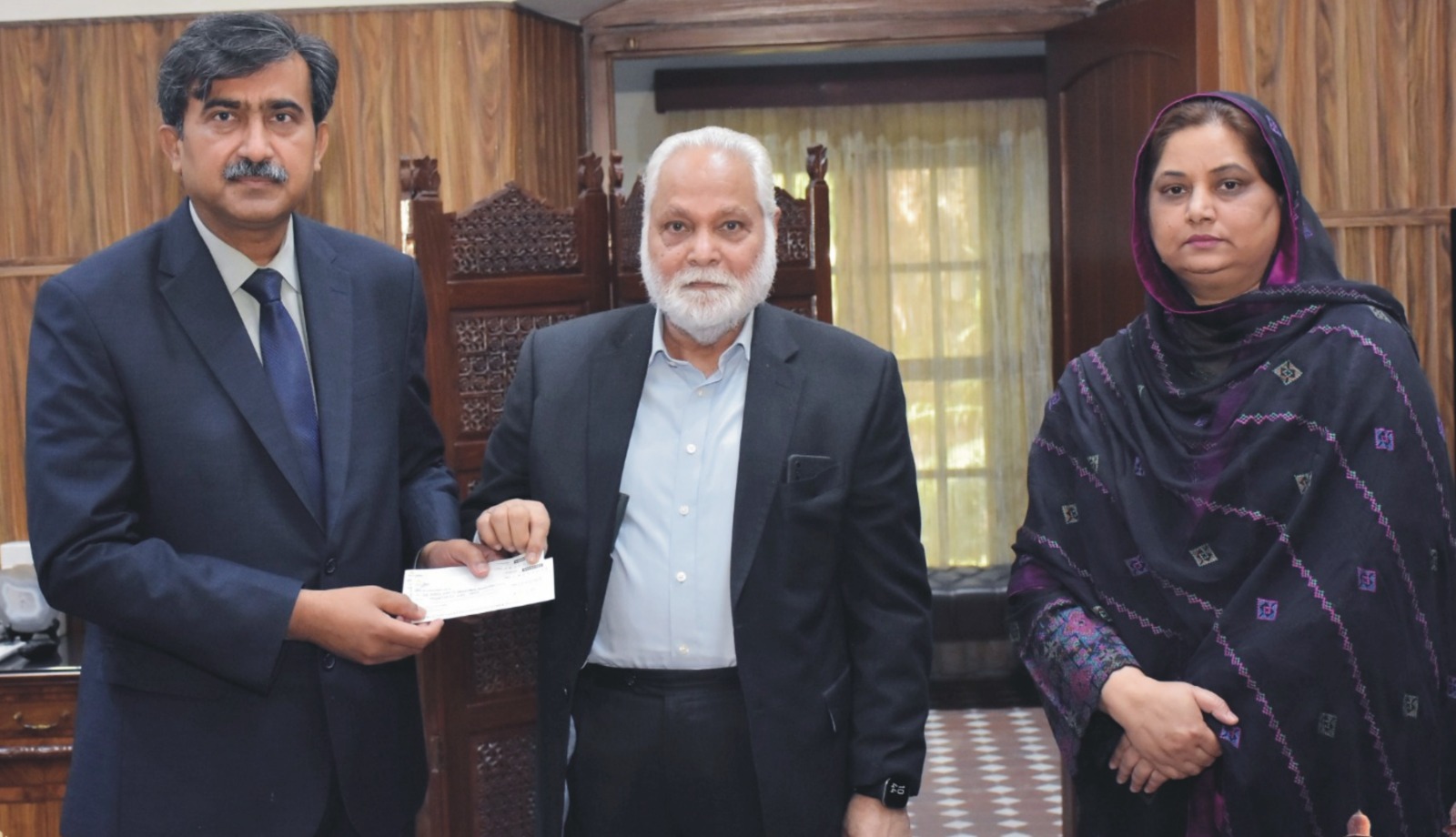 UAF scholarships cheque distribution ceremony led by Dr Pervez Sultan and Prof Dr Zulfiqar Ali