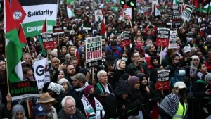 pro-Palestine rally London — demonstrators on Albert Embankment waving Palestinian flags at Al-Quds Day static demonstration March 15 2026 after march ban