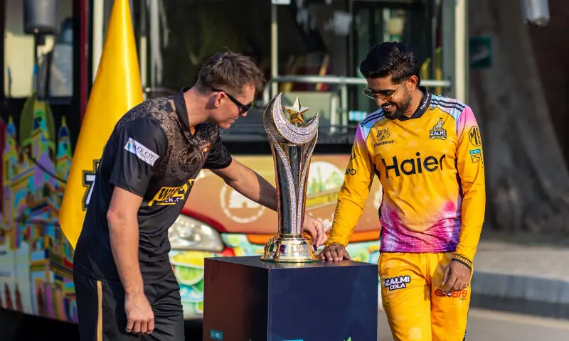 Babar Azam lifting PSL 2026 trophy with Peshawar Zalmi team at Gaddafi Stadium Lahore