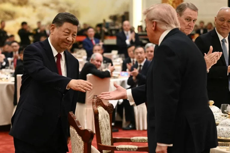 Trump and Xi Jinping shake hands at the Beijing summit discussing US-China trade war and tariff relations in May 2026