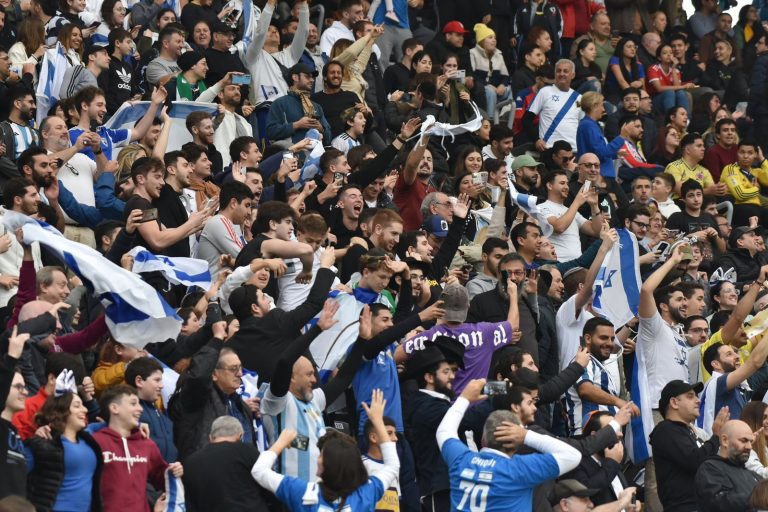 Football fans protesting during Ireland and Qatar match over Israel football dispute and boycott debate