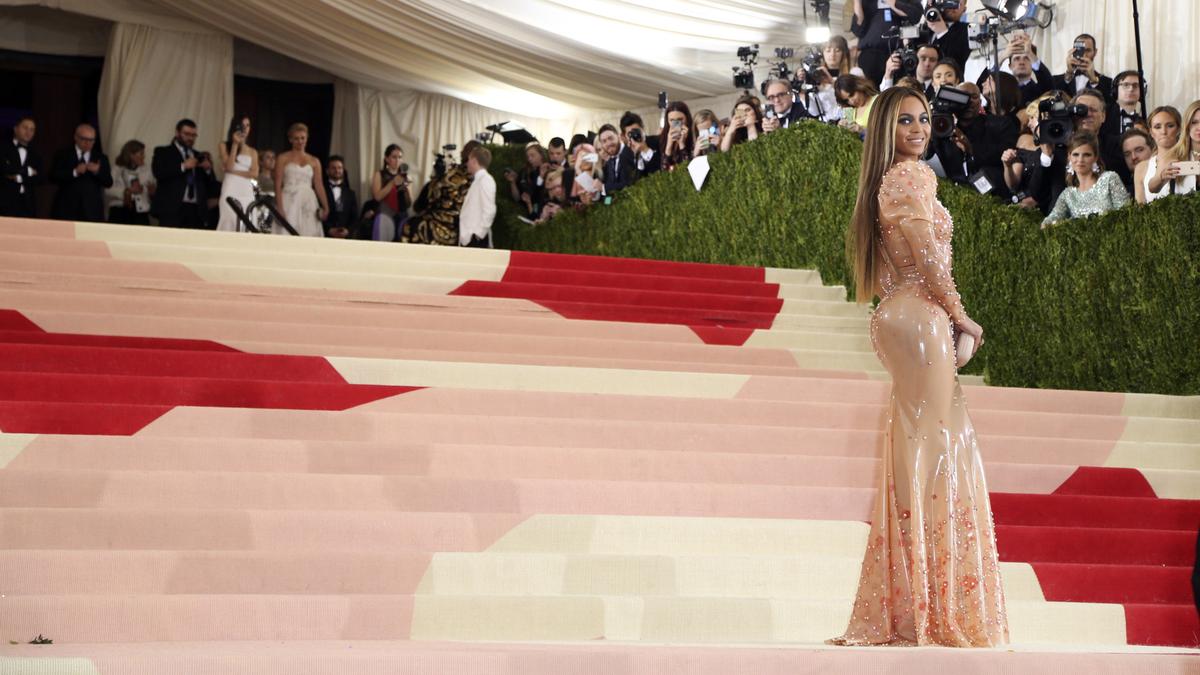 Celebrities arriving on the Met Gala 2026 red carpet at the Metropolitan Museum of Art in New York, dressed in haute couture for the "Costume Art" theme.