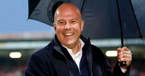 Arne Slot standing in the Liverpool dugout at Anfield during a Premier League match in 2026