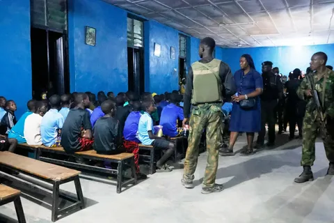 Armed gunmen on motorcycles near a school in Borno State, Nigeria, amid ongoing security crisis and education struggle