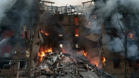 Destroyed buildings and emergency vehicles in Kyiv following a Russian ballistic missile and drone attack, May 2026