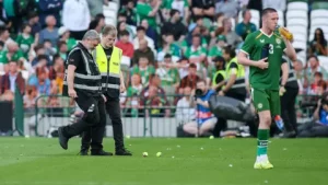 Football fans protesting during Ireland and Qatar match over Israel football dispute and boycott debate