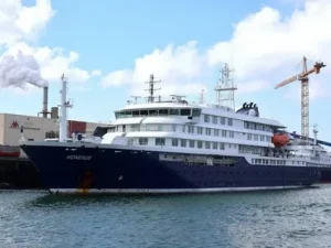 Cruise ship MV Hondius anchored off the port of Praia, Cape Verde, amid a suspected hantavirus outbreak that has killed three passengers May 2026.