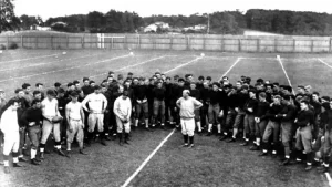 Walter Camp the father of American football standing with early Yale football team in the 1880s