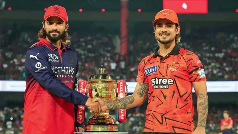 Cricket players celebrating a wicket during IPL 2026 match at a packed stadium in India