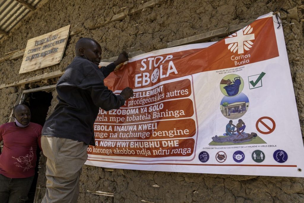 Healthcare workers responding to the Ebola outbreak 2026 while monitoring patients and preventing virus transmission.