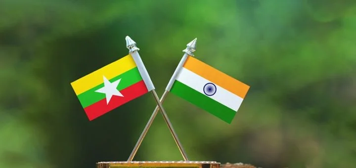 Indian and Myanmar flags displayed during a bilateral diplomatic meeting discussing regional security and economic cooperation.
