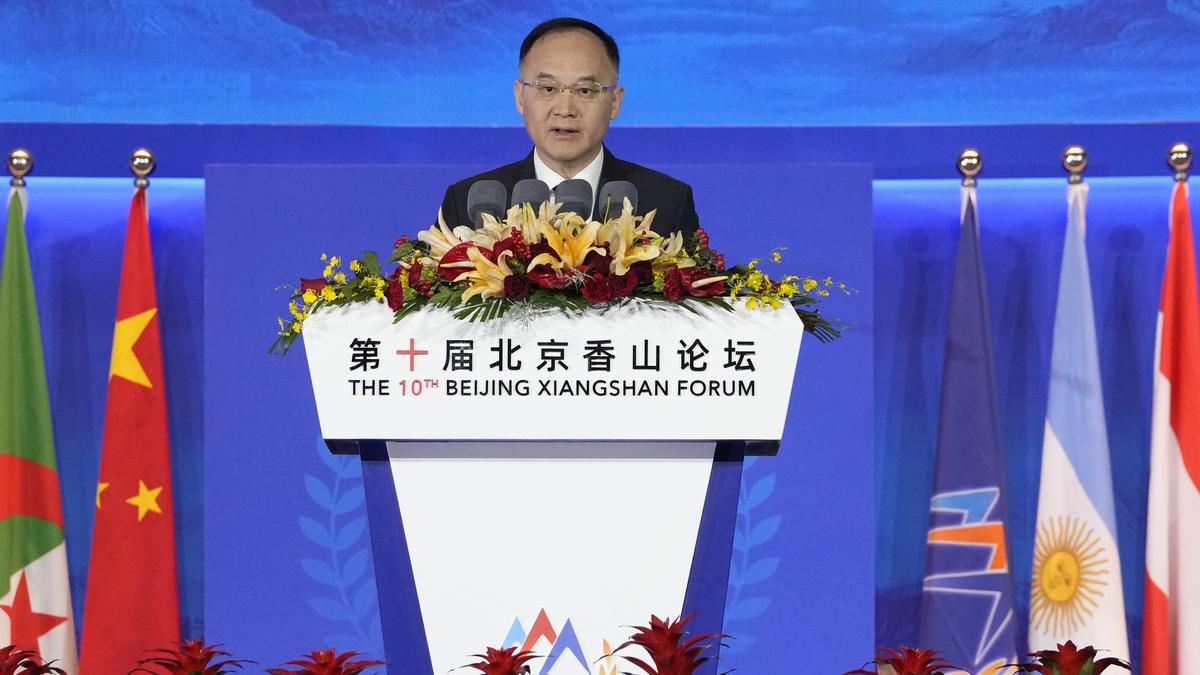 Chinese and Myanmar flags displayed during a high-level diplomatic meeting discussing border security, trade, and economic cooperation.
