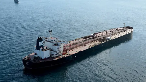 Oil tanker at sea operating as part of the Russian shadow fleet network amid Western sanctions enforcement in 2026.