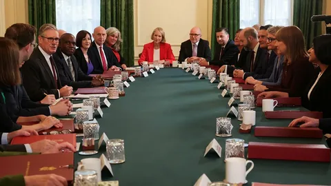 UK Prime Minister facing political pressure during parliamentary discussions in London