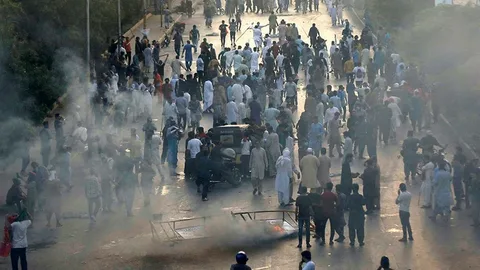 Burning vehicles and protest scenes during May 9 2023 unrest in Pakistan cities