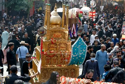 Black flags and banners displayed during Muharram in Pakistan streets