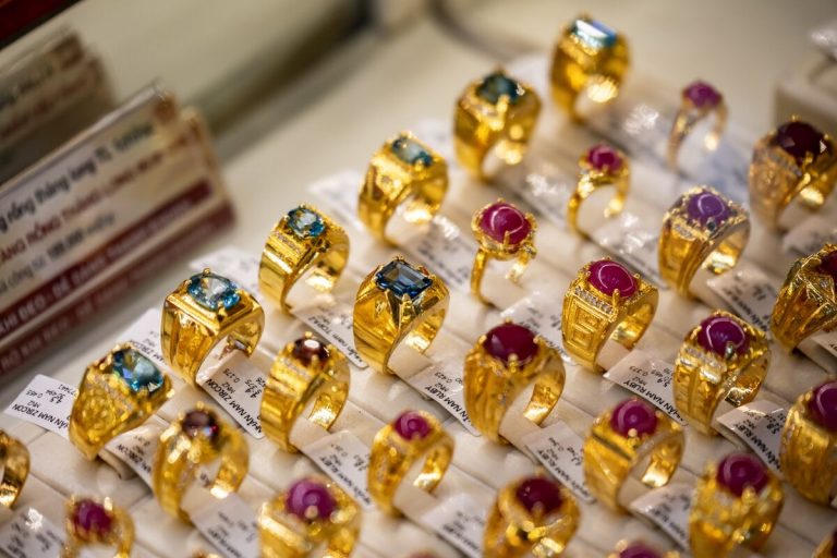 Vietnamese police investigators examining seized diamonds and jewellery during a major smuggling ring probe in Ho Chi Minh City, Vietnam