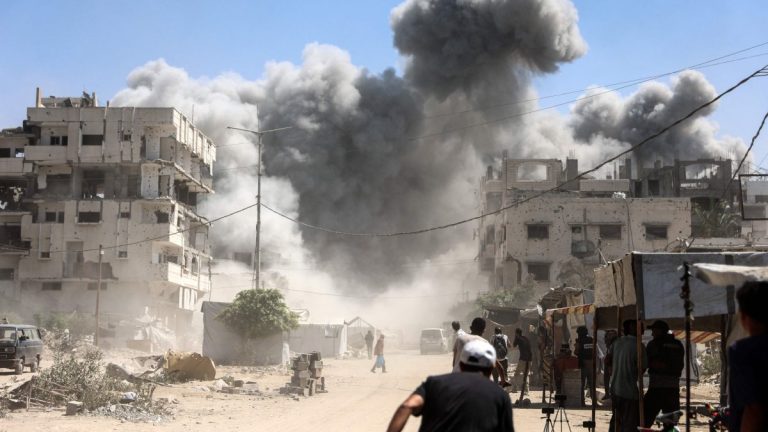 Smoke rises over Gaza following airstrikes as the Israel-Palestine conflict continues despite ceasefire efforts.