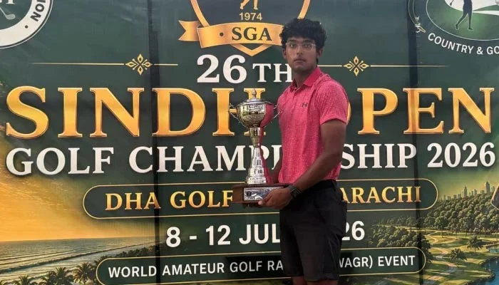 Amateur golfer Omar Khalid celebrates after winning the Sindh Open Golf Championship.