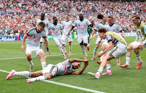 Belgium players celebrate after a dramatic 3-2 extra-time comeback victory over Senegal in the FIFA World Cup 2026 Round of 32.