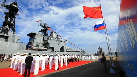 Russian and Chinese naval warships sailing together during the Joint Sea-2026 military exercise near Qingdao, China
