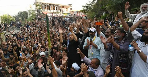 Awami Action Committee Azad Kashmir protesters and security forces during a rally in Muzaffarabad
