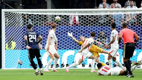 Argentina players hold "Las Malvinas Son Argentinas" banner after beating England in the 2026 World Cup semi-final, sparking FIFA controversy.