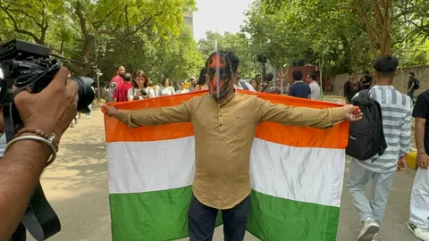 Cockroach Janata Party supporters at Jantar Mantar protest site in New Delhi on July 20 2026 demanding resignation of Education Minister Dharmendra Pradhan