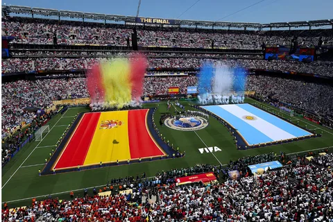 FIFA World Cup 2026 closing ceremony stage with Trump, Infantino, and Spain players celebrating with the trophy under stadium lights