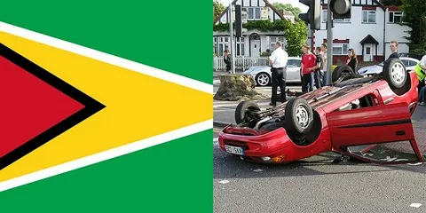 A busy road in Guyana showing vehicles and road safety signage highlighting transport safety challenges in 2021 and 2022