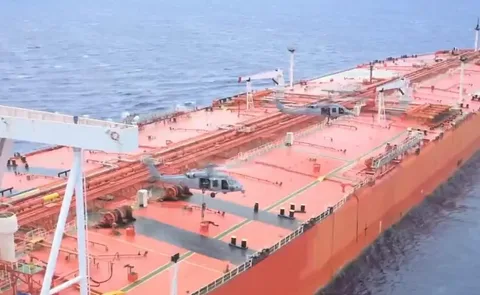 Oil tanker transporting Iranian crude near Malaysian waters amid US sanctions enforcement and naval blockade.