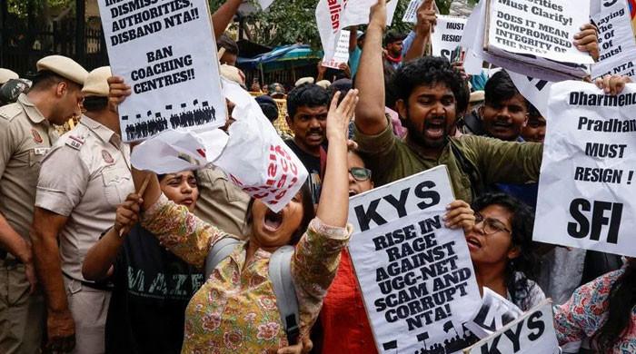 Students protesting against exam paper leaks in India as the government announces tougher penalties under the Anti Cheating Act.