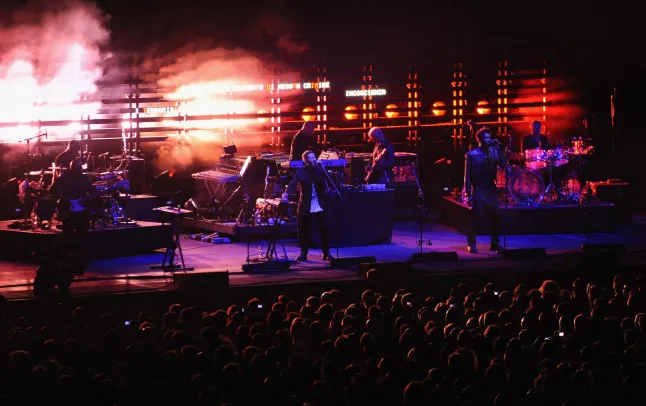 Massive Attack members Robert Del Naja and Grant Marshall on stage holding a Palestinian flag during their concert at the Star Theatre in Singapore on July 29 2026