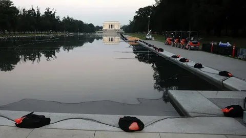 Washington's Reflecting Pool involved in a legal dispute after alleged damage during a renovation project.