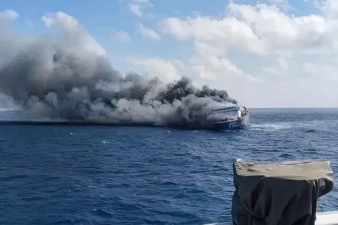 Rescue teams respond after a ferry catches fire off Madura Island, Indonesia.