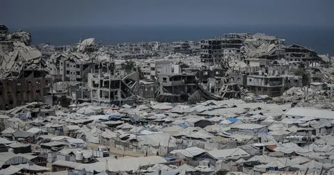 Palestinians inspect the rubble of destroyed buildings in Gaza City as the Israel Gaza ceasefire agreement remains fragile amid ongoing Israeli strikes in 2026