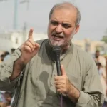 JI workers gathered at a sit-in demonstration ahead of the party's march towards Islamabad