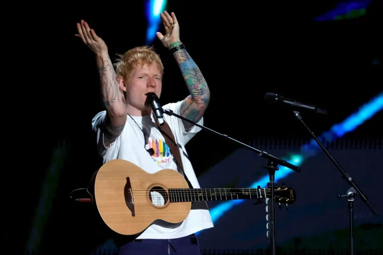 Macklemore performing live on stage before being dropped from Ed Sheeran's Loop Tour