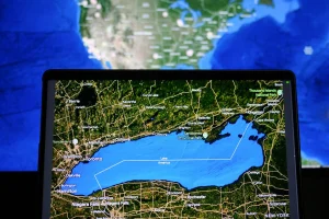 Split map view comparing Lake Ontario label in Canada with Lake America label in the United States