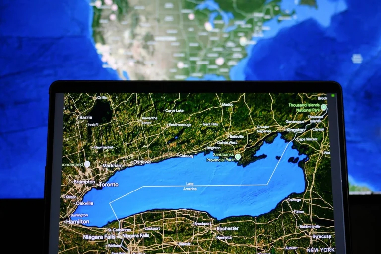 Split map view comparing Lake Ontario label in Canada with Lake America label in the United States