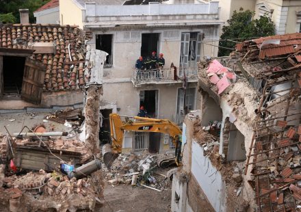 Emergency responders inspect the site of the Athens explosion in the Plaka district near the Acropolis