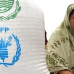 A mother and young child receive nutrition screening support under a WFP Pakistan program at a facilitation centre
