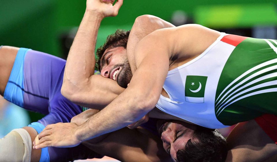 Pakistani wrestlers Inayat Ullah and Muhammad Gulzar compete in freestyle bouts at the Asian Games in Nagoya