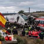 Emergency responders inspect the wreckage of a passenger train following a deadly railway collision in Spain.