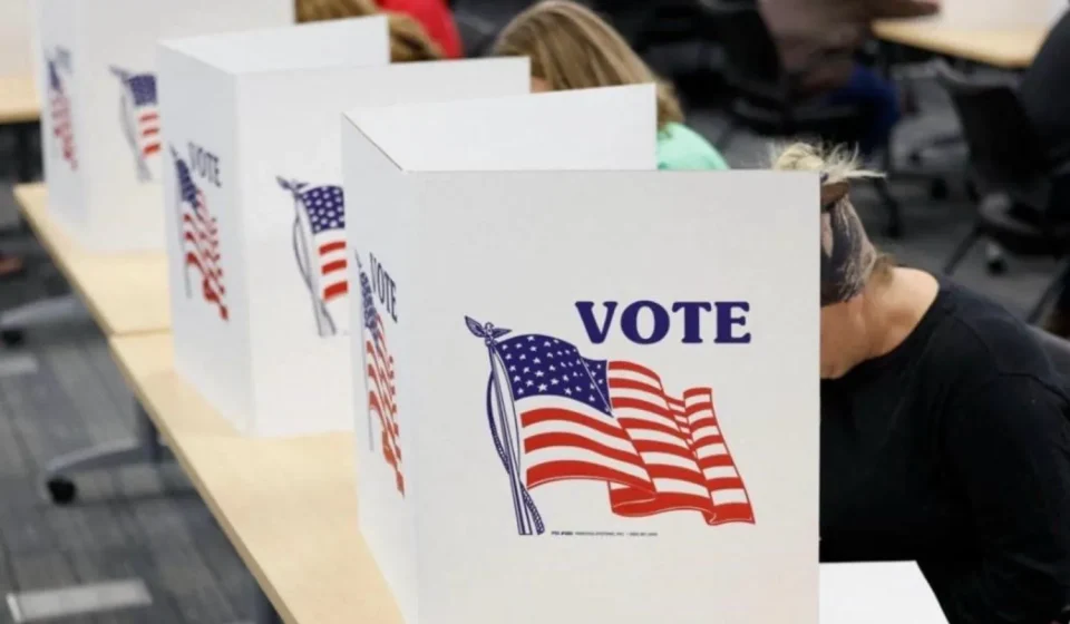 Voters casting ballots at an early voting polling station in Texas