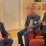 Community members attend a political gathering in Maryland ahead of the 2026 US midterm elections, discussing healthcare, education and public assistance policies.
