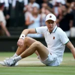 Jannik Sinner holding the Wimbledon trophy before his knee injury ended his 2026 tennis season